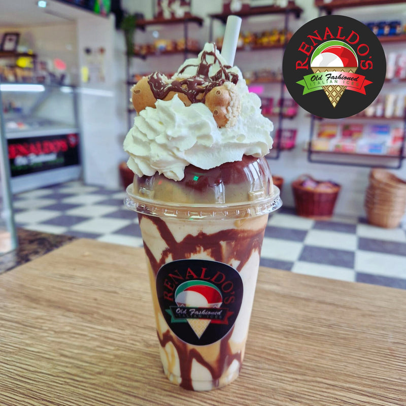 Plastic cup with domed lid filled with smoothie